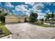 Beautiful yellow home with three car garage and pond view at 9351 Raes Creek Pl, Palmetto, FL 34221