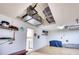 Garage with AC unit, storage shelving, and laundry access at 9351 Raes Creek Pl, Palmetto, FL 34221