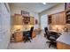 Spacious home office with dual work stations and built-in storage at 9351 Raes Creek Pl, Palmetto, FL 34221