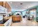 Open kitchen with granite counters, stainless steel appliances, and breakfast nook at 9351 Raes Creek Pl, Palmetto, FL 34221