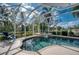 Inviting screened pool and spa with golf course view at 9351 Raes Creek Pl, Palmetto, FL 34221