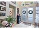 Inviting entryway with double doors and decorative wreaths at 8412 Whispering Woods Ct, Lakewood Ranch, FL 34202