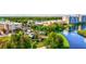 Aerial of town center with shops, lake, and walking paths at 8412 Whispering Woods Ct, Lakewood Ranch, FL 34202