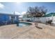 Relaxing kidney-shaped pool with patio and outdoor furniture at 104 23Rd St, Bradenton Beach, FL 34217