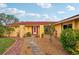 House exterior with red door and stone pathway at 1051 N Cypress Point Dr, Venice, FL 34293