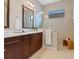 Spa-like bathroom with double vanity and walk-in shower at 10828 Trophy Dr, Englewood, FL 34223