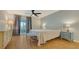 Main bedroom with light flooring, ceiling fan and access to a balcony at 119 Tidewater Dr # 119, Bradenton, FL 34210