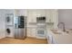 Updated kitchen featuring stainless steel appliances and white cabinetry at 119 Tidewater Dr # 119, Bradenton, FL 34210