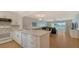 Modern white kitchen with breakfast bar at 119 Tidewater Dr # 119, Bradenton, FL 34210