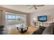 Bright living room with water views, featuring a glass coffee table and comfortable seating at 119 Tidewater Dr # 119, Bradenton, FL 34210