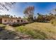 Large backyard with grassy area and mature trees at 1397 Harbor Dr, Sarasota, FL 34239