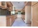 Light wood kitchen cabinets and granite countertops at 1397 Harbor Dr, Sarasota, FL 34239