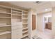 Walk-in closet with built-in shelving and drawers at 1397 Harbor Dr, Sarasota, FL 34239
