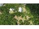 Aerial view of home with pool and large lot at 14018 Pine Woods E Ln, Sarasota, FL 34240