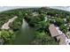 Aerial view of waterfront community with lush landscaping and canals at 1611 Clower Creek Dr # Ha236, Sarasota, FL 34231