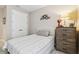 Charming bedroom with a full-size bed and built-in shelving at 16714 Savory Mist Cir, Bradenton, FL 34211
