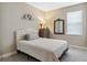 Cozy bedroom with a queen-size bed and neutral color scheme at 16714 Savory Mist Cir, Bradenton, FL 34211