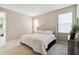 Comfortable bedroom with king-size bed and neutral decor at 16714 Savory Mist Cir, Bradenton, FL 34211