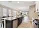 Open kitchen with large island and views into the living area at 16714 Savory Mist Cir, Bradenton, FL 34211