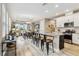 Open concept kitchen with island seating and hardwood floors at 16714 Savory Mist Cir, Bradenton, FL 34211
