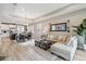 Open living room with views into kitchen and dining areas at 16714 Savory Mist Cir, Bradenton, FL 34211