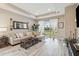 Light and airy living room featuring a comfortable sectional sofa and large windows at 16714 Savory Mist Cir, Bradenton, FL 34211
