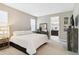 Spacious main bedroom with plush bed and ensuite bathroom access at 16714 Savory Mist Cir, Bradenton, FL 34211