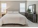 Bright bedroom with king-size bed and ample space at 16714 Savory Mist Cir, Bradenton, FL 34211
