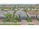 Aerial view of a house with landscaping in a residential community at 1724 Hyssop Loop, North Port, FL 34289