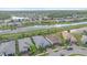 Aerial view of homes and a canal in a residential community at 1724 Hyssop Loop, North Port, FL 34289