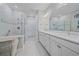 Modern bathroom with double vanity and a large walk-in shower at 1724 Hyssop Loop, North Port, FL 34289