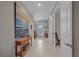 Light and airy entryway with a console table and large artwork at 1724 Hyssop Loop, North Port, FL 34289