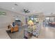 Bright living room features a comfy sofa, large TV, and stylish decor at 1724 Hyssop Loop, North Port, FL 34289