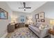 Home office with a desk, couch, and decorative rug at 1724 Hyssop Loop, North Port, FL 34289