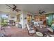 Outdoor living space with seating, grill, and access to the home at 1724 Hyssop Loop, North Port, FL 34289