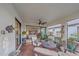 Relaxing screened porch with comfortable seating and lovely view at 1724 Hyssop Loop, North Port, FL 34289