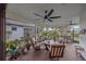 Relaxing screened porch with brick flooring and comfortable seating at 1724 Hyssop Loop, North Port, FL 34289