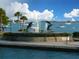 Circular fountain featuring playful dolphin sculptures, waterfront view at 174 Golden Gate Pt # 21, Sarasota, FL 34236