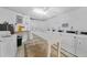 Well-equipped laundry room with multiple washers and dryers at 2110 Benjamin Franklin Dr # 105, Sarasota, FL 34236