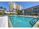 Resort-style community pool with ample deck space at 2110 Benjamin Franklin Dr # 105, Sarasota, FL 34236