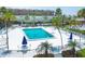 Clean and inviting community pool area with plenty of lounge chairs at 2110 Benjamin Franklin Dr # 105, Sarasota, FL 34236