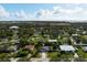 Aerial view of neighborhood showing property, nearby buildings and waterways in distance at 2332 Pinehurst St, Sarasota, FL 34231