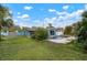 Large backyard with pool and blue house at 2332 Pinehurst St, Sarasota, FL 34231