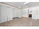 Bedroom with tile floors, mirrored closet doors and ensuite bathroom at 2332 Pinehurst St, Sarasota, FL 34231