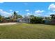 Cute blue house with a spacious grassy front yard at 2332 Pinehurst St, Sarasota, FL 34231