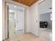 Hallway with tiled floors and doors to bathroom and Gathering room at 2332 Pinehurst St, Sarasota, FL 34231