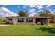 Home's back exterior, showcasing a screened patio at 2506 41St E St, Bradenton, FL 34208