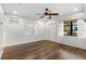 Living room with hardwood floors, ceiling fan, and window at 2538 Floyd St, Sarasota, FL 34239