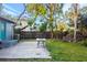 Concrete patio area with table and green space at 3135 Alta Vista St, Sarasota, FL 34237