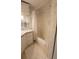 Bathroom with tub and shower, and floral wallpaper at 3333 26Th E Ave # 1148, Bradenton, FL 34208